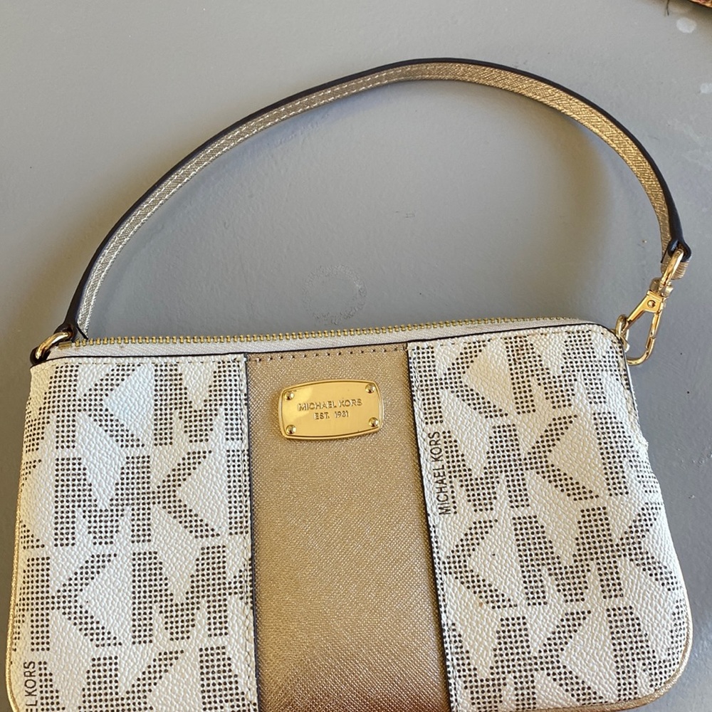 Michael Kors small wristlet, beautiful rose gold and light brown color
